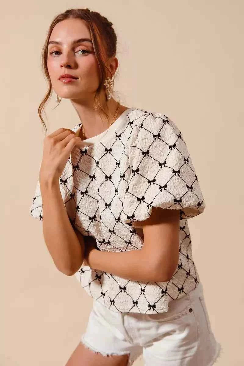 Ivory Bow Texture Woven Bubble Sleeve Top by So Me