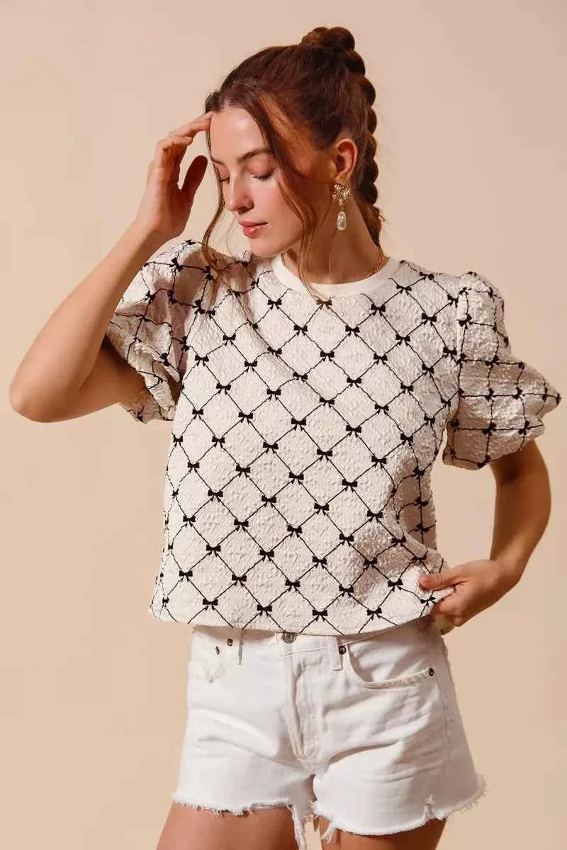 Ivory Bow Texture Woven Bubble Sleeve Top by So Me