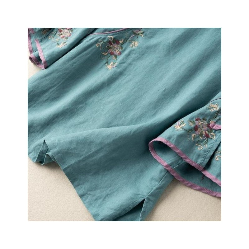 Sure! How about "Chic Embroidered Mandarin Collar Cotton and Linen Tea Dress"?