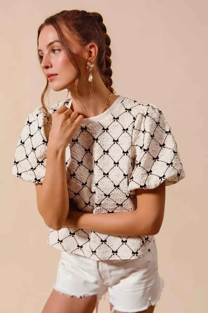 Ivory Bow Texture Woven Bubble Sleeve Top by So Me