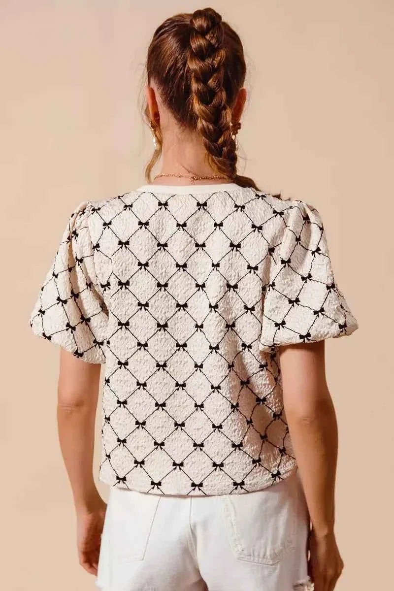 Ivory Bow Texture Woven Bubble Sleeve Top by So Me