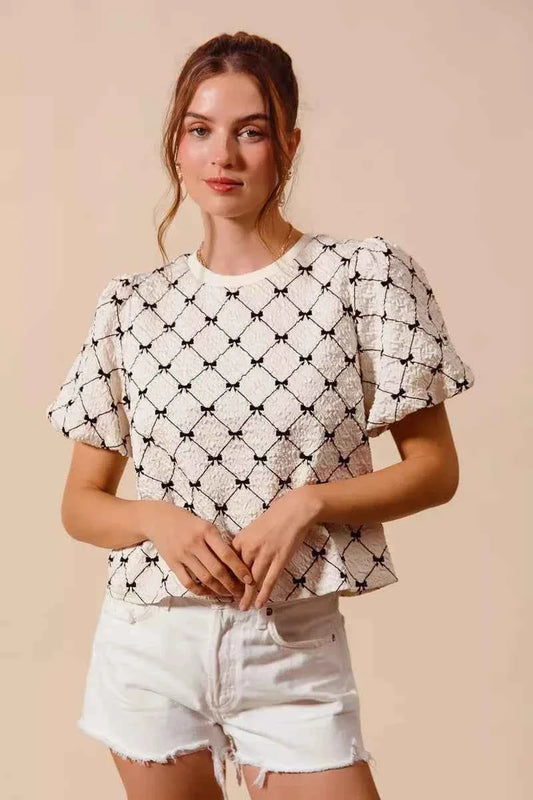 Ivory Bow Texture Woven Bubble Sleeve Top by So Me