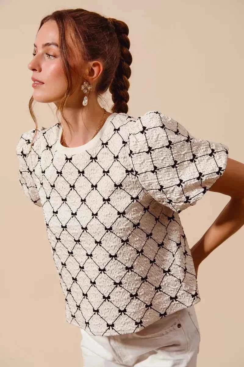 Ivory Bow Texture Woven Bubble Sleeve Top by So Me