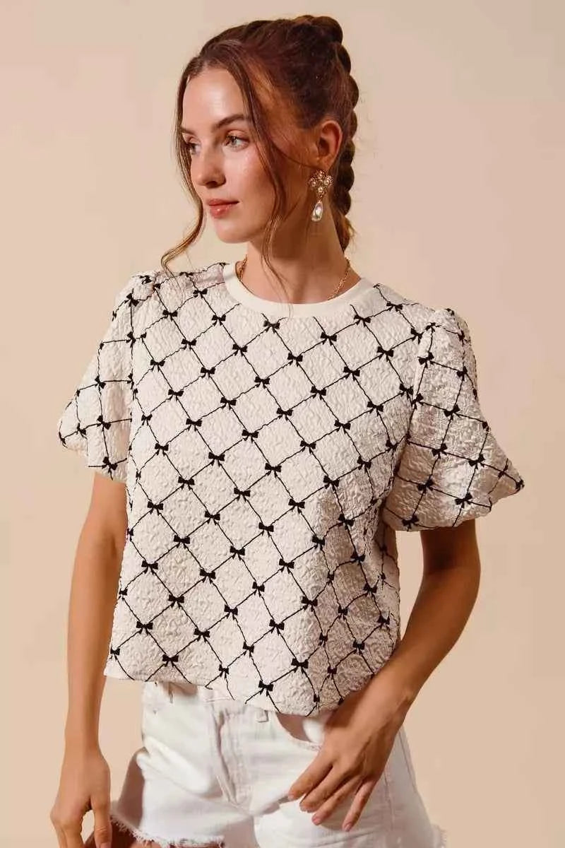 Ivory Bow Texture Woven Bubble Sleeve Top by So Me