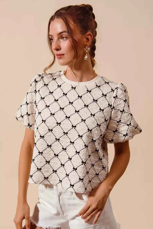 Ivory Bow Texture Woven Bubble Sleeve Top by So Me