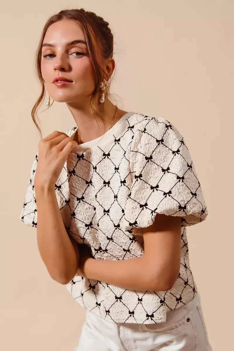 Ivory Bow Texture Woven Bubble Sleeve Top by So Me