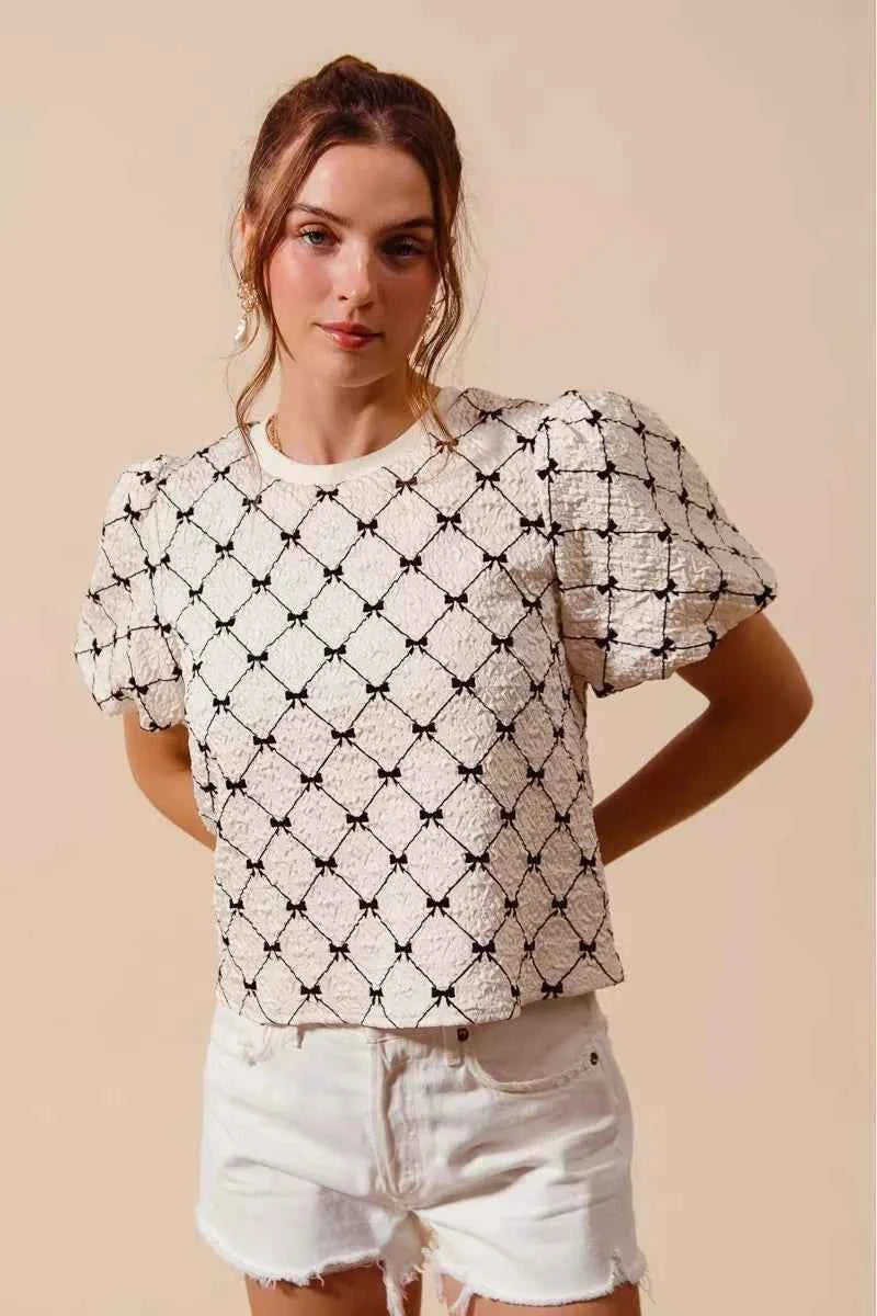 Ivory Bow Texture Woven Bubble Sleeve Top by So Me